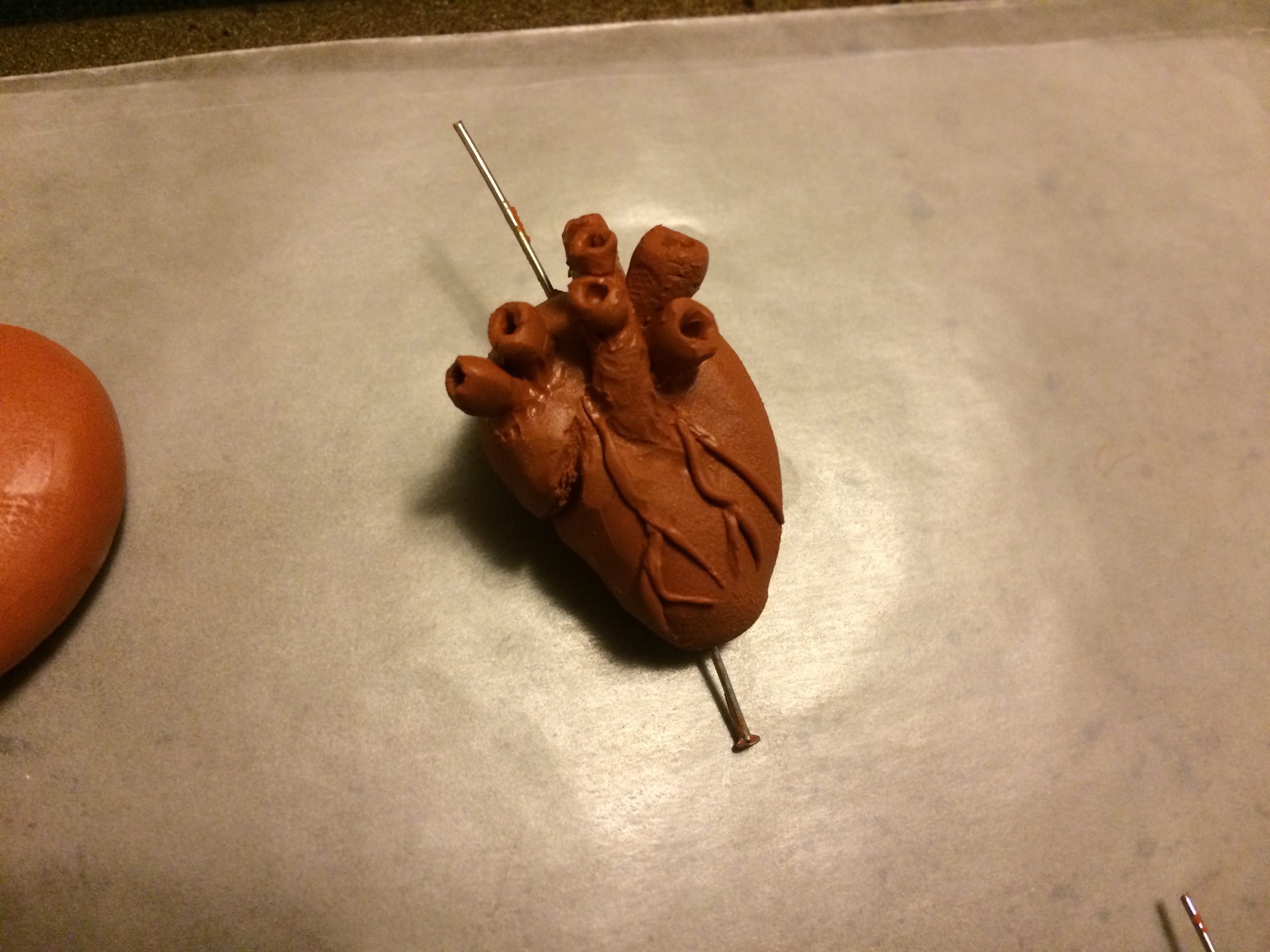 Single clay human heart pendant